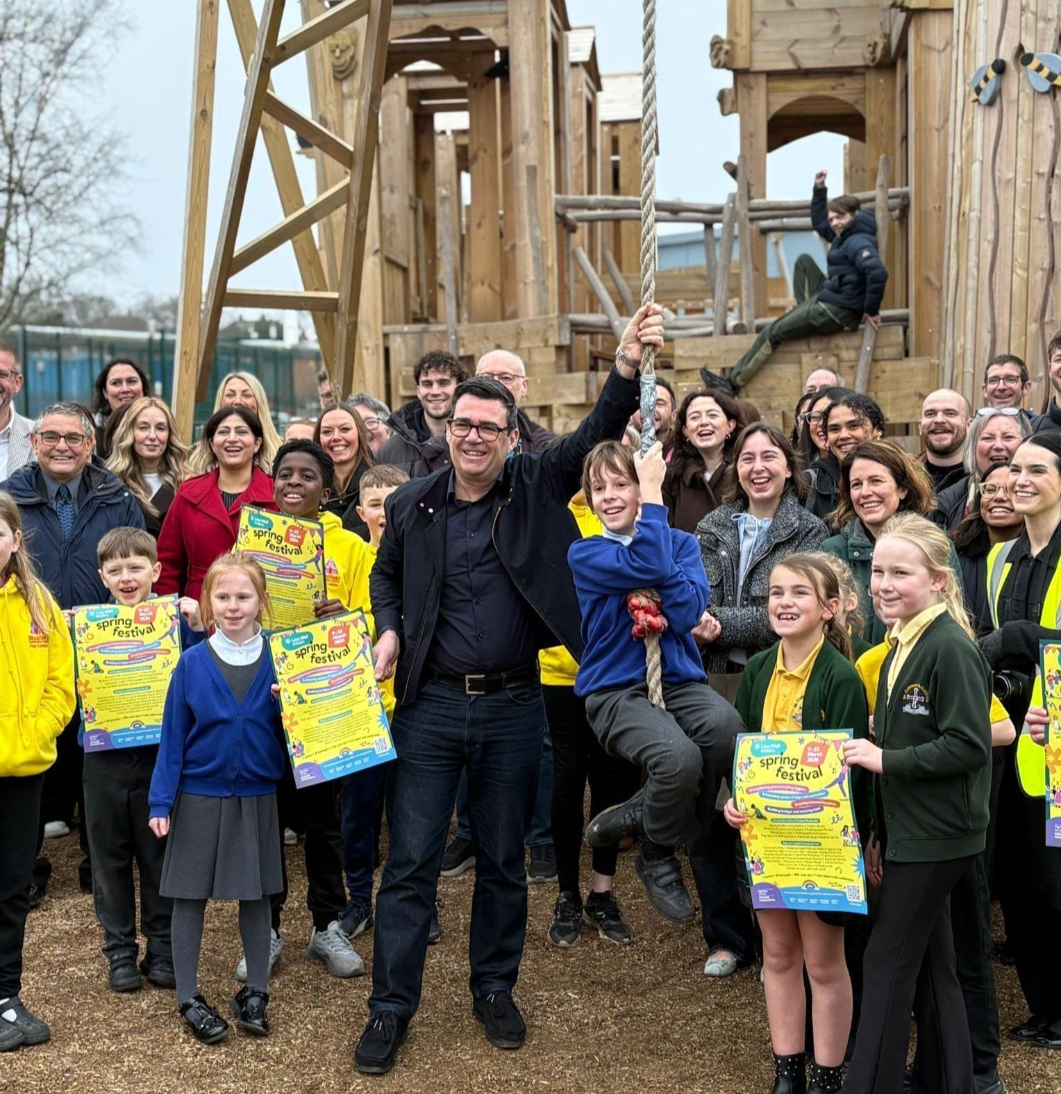 Andy Burnham with children at Norley Hall Adventure Playground